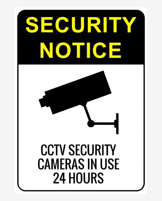 A security notice sign with a camera icon and text indicating CCTV security cameras in use for 24 hours.