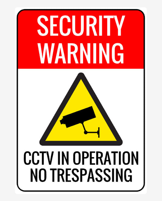 A security warning sign featuring a yellow triangle with a black border, and a CCTV camera icon in the center. The text on the sign reads 'SECURITY WARNING CCTV IN OPERATION NO TRESPASSING'.