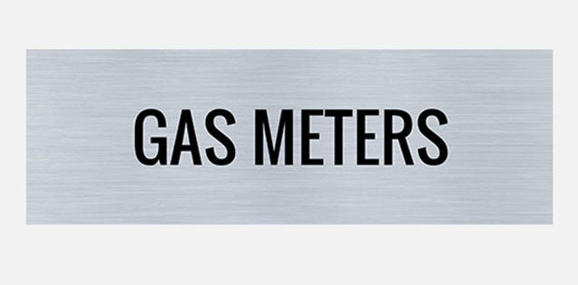A metal sign with the words 'GAS METERS' printed in capital letters, presented in a plain style font on a silver background.