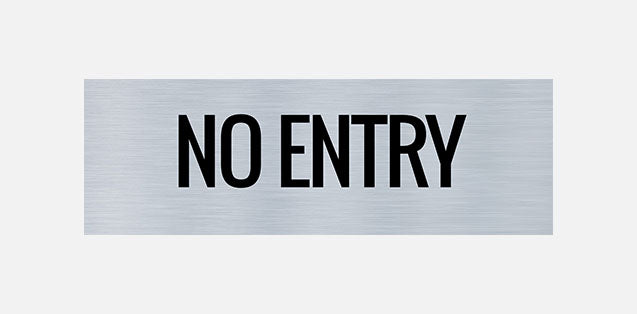 A metal door sign with the text 'NO ENTRY' printed in black.
