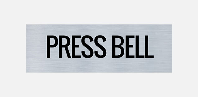 A metal sign with the words 'PRESS BELL' printed in capital letters.
