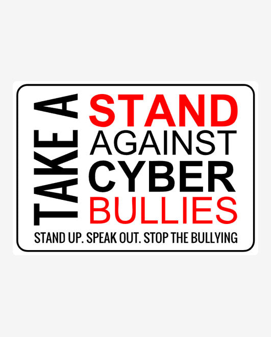 A rectangular sign with white background and black and red text stating 'TAKE A STAND AGAINST CYBER BULLIES. STAND UP.