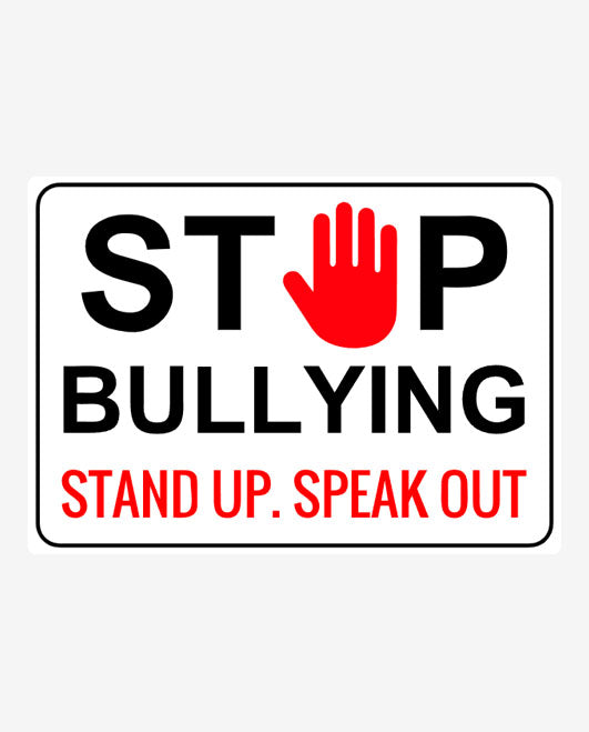 A sign with a white background featuring the text 'STOP BULLYING' in bold capital letters, with a red hand symbol and the phrase 'STAND UP. SPEAK OUT' in smaller text.