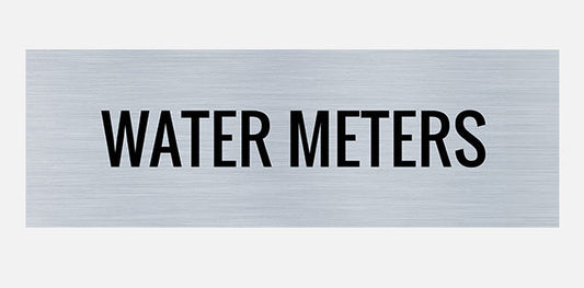 A rectangular metal sign with the words 'WATER METERS' printed in capital letters.